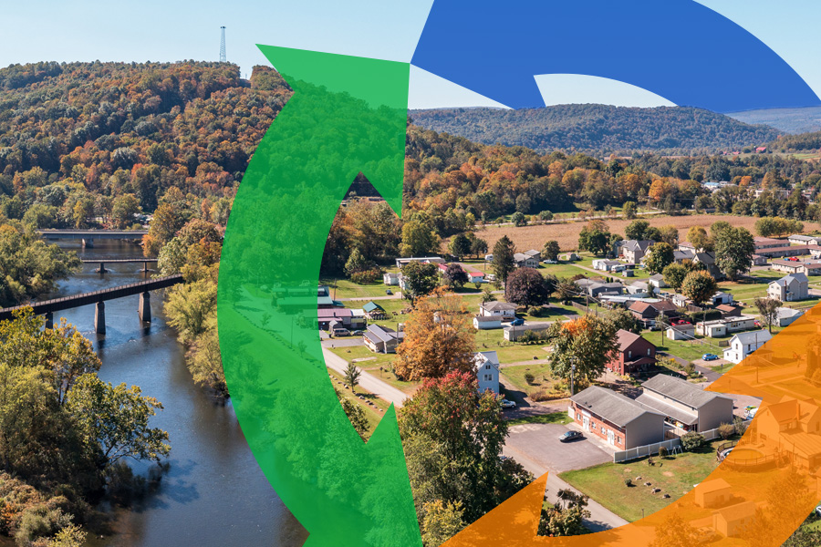 Arial shot of a rural town next to a river with a Conexon icon overtop.